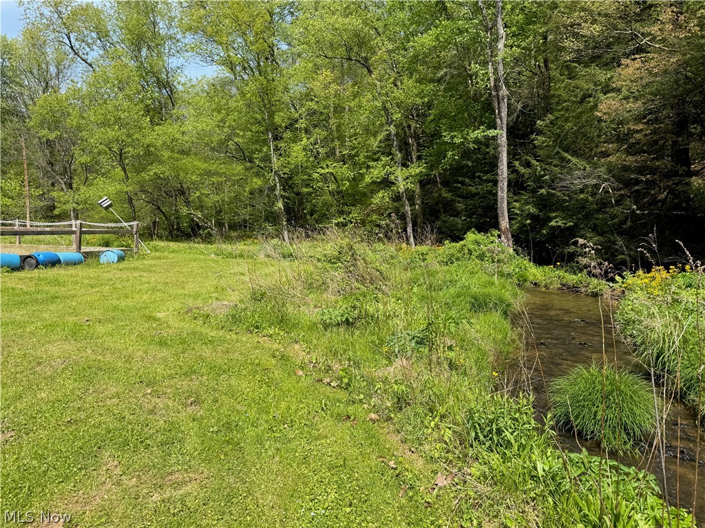 11811 Gaston Road Rogers, OH 44455 - Photo 13 of 38 Rough Run Creek runs into Beaver Creek through this property. Listen to the water as you stroll through your property and enjoy the sounds of nature!