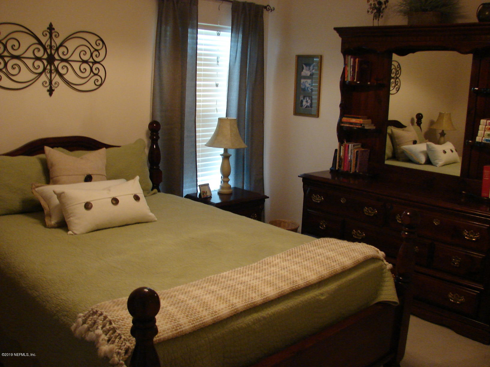 1535 Royal County Drive Jacksonville, FL 32221 - Photo 24 of 38 a bedroom with a bed and a window