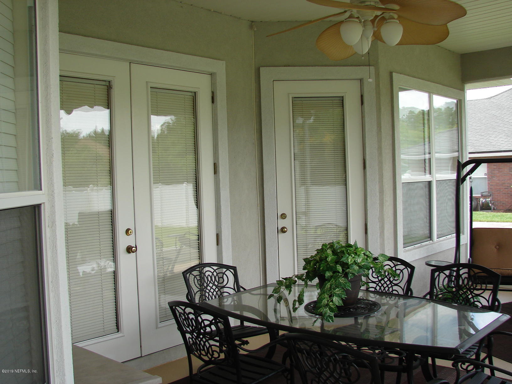 1535 Royal County Drive Jacksonville, FL 32221 - Photo 34 of 38 a table and chairs in a balcony