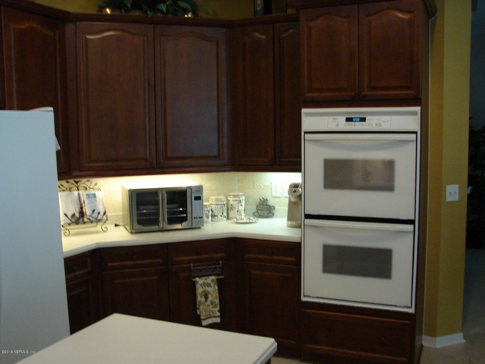 1535 Royal County Drive Jacksonville, FL 32221 - Photo 10 of 38 a kitchen with a cabinets and appliances