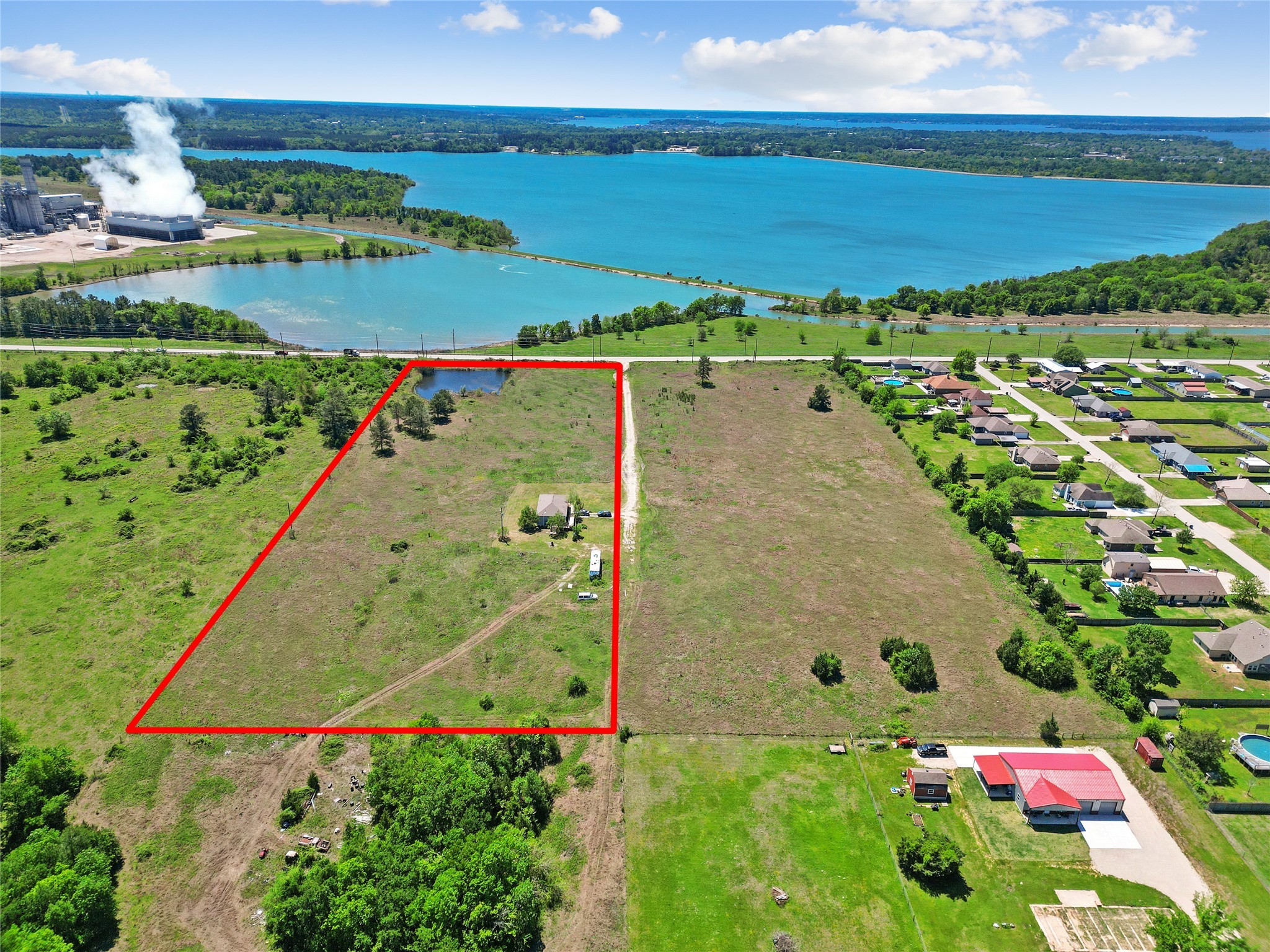 11242 Longstreet Road Willis, TX 77318 - Photo 3 of 10 an aerial view of a house with a garden