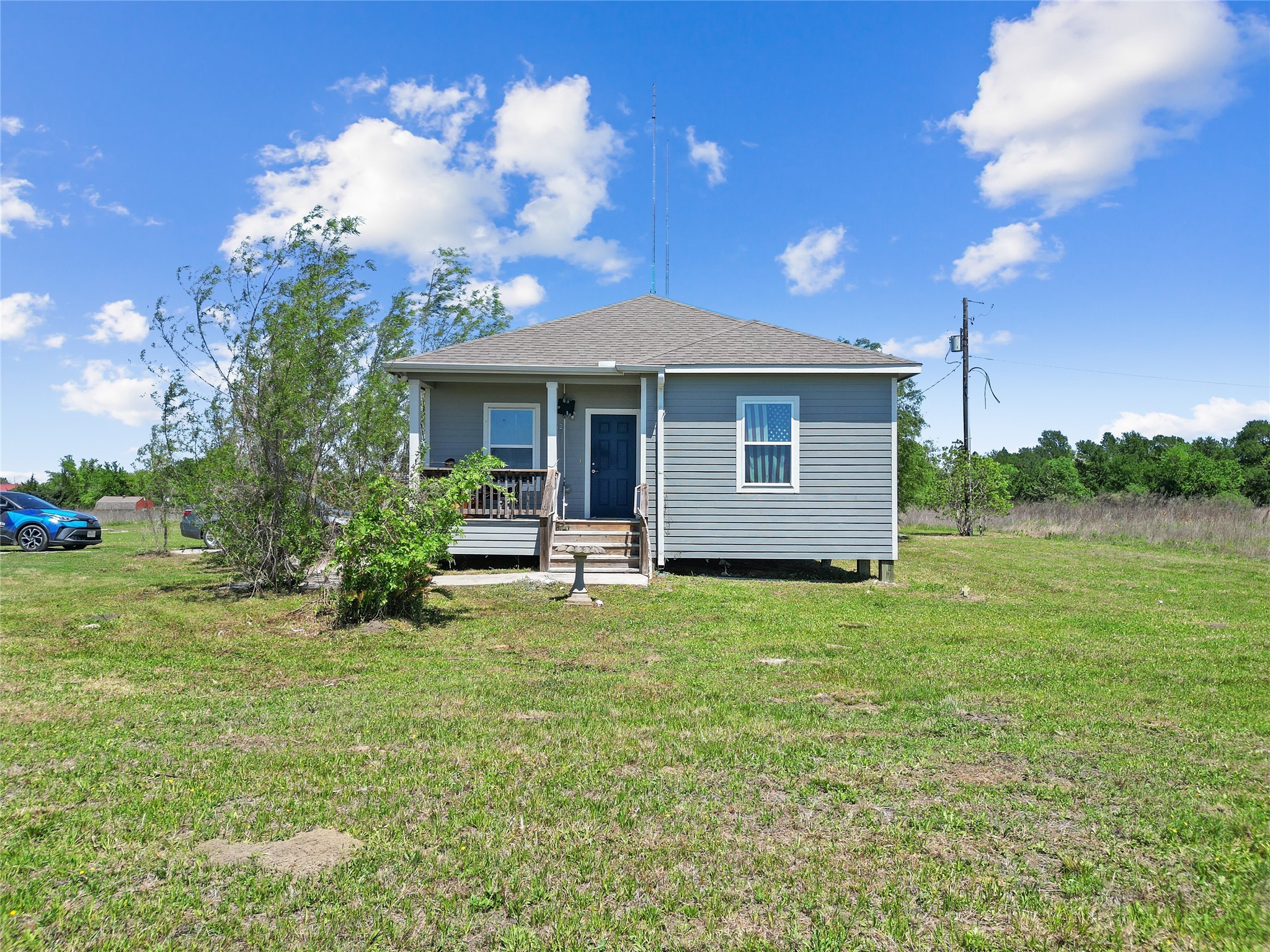 11242 Longstreet Road Willis, TX 77318 - Photo 8 of 10 a backyard of a house with table and chairs plants and large tree