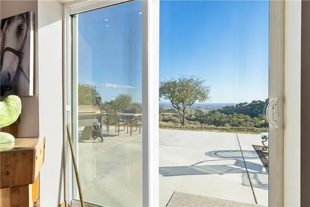a bedroom with a bed and a chandelier fan