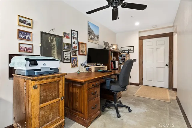 a bedroom with furniture and flat screen tv