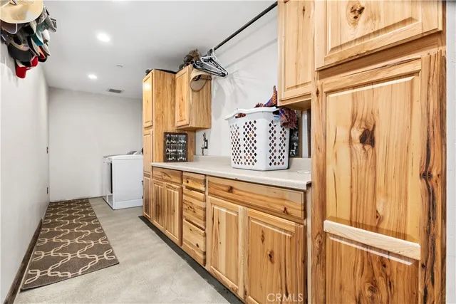 a bathroom with a granite countertop sink a toilet and mirror
