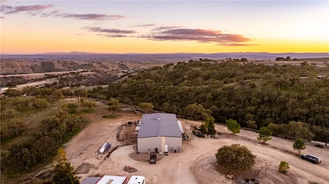 an aerial view of a house with a garden