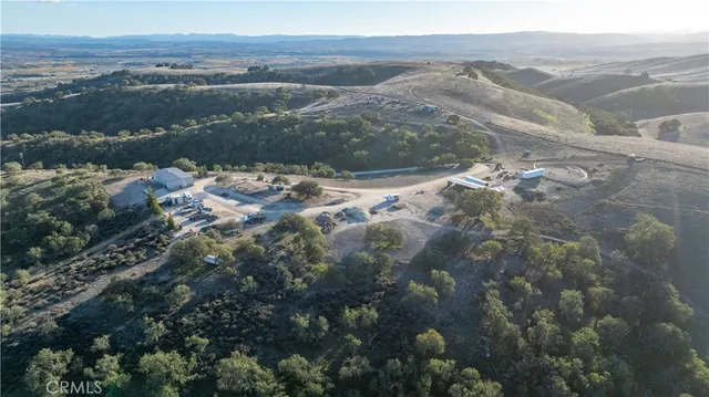 an aerial view of residential building and ocean view