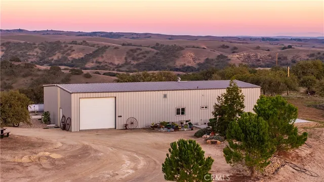 a view of a big yard with lots of green space