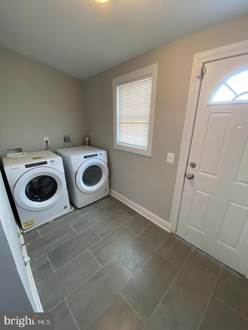 325 East 21st Street Baltimore, MD 21218 - Photo 11 of 28 a utility room with dryer and washer