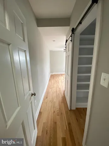 a view of entryway with wooden floor