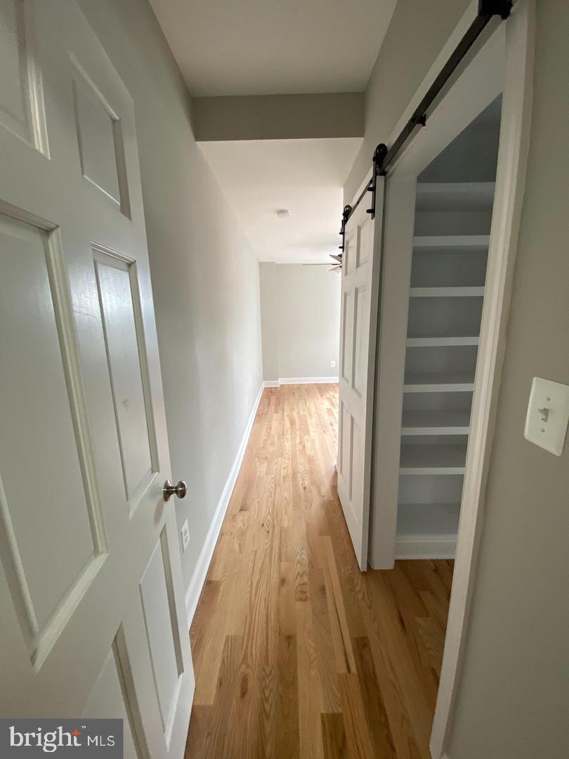 325 East 21st Street Baltimore, MD 21218 - Photo 16 of 28 a view of entryway with wooden floor