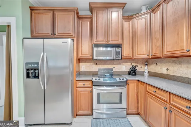 a view of storage and utility room with washer and dryer