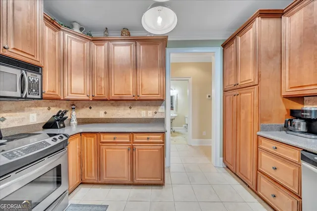 a view of a patio with furniture and garden view