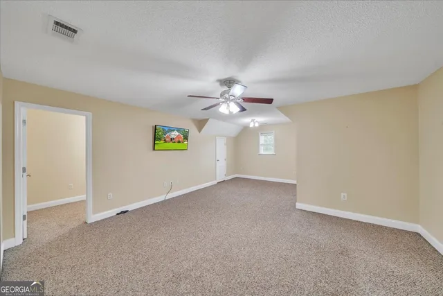 a bathroom with a sink a large mirror and a toilet
