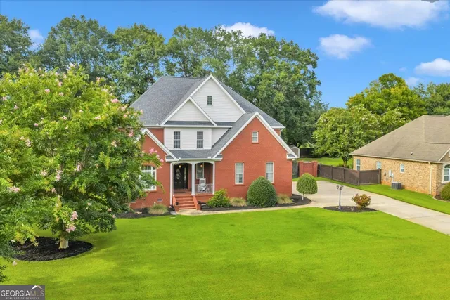 front view of a house with a yard
