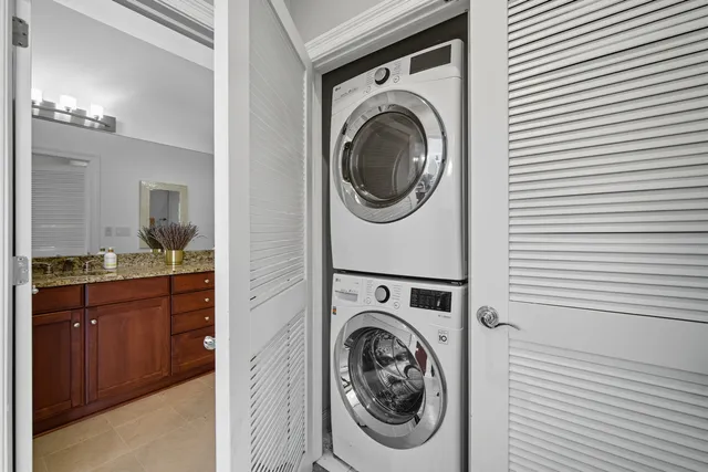 a view of a hallway with washer and dryer