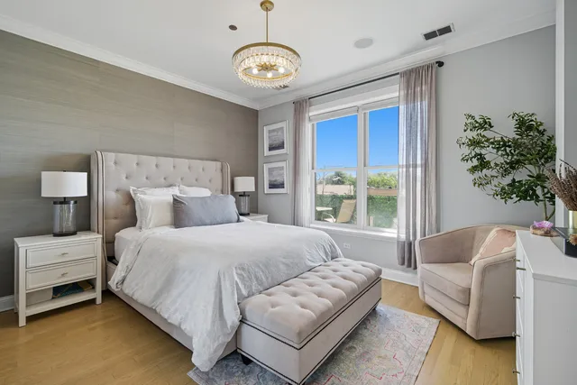 a spacious bedroom with a bed and a couch