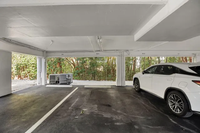 a swimming pool with outdoor seating and a potted plant