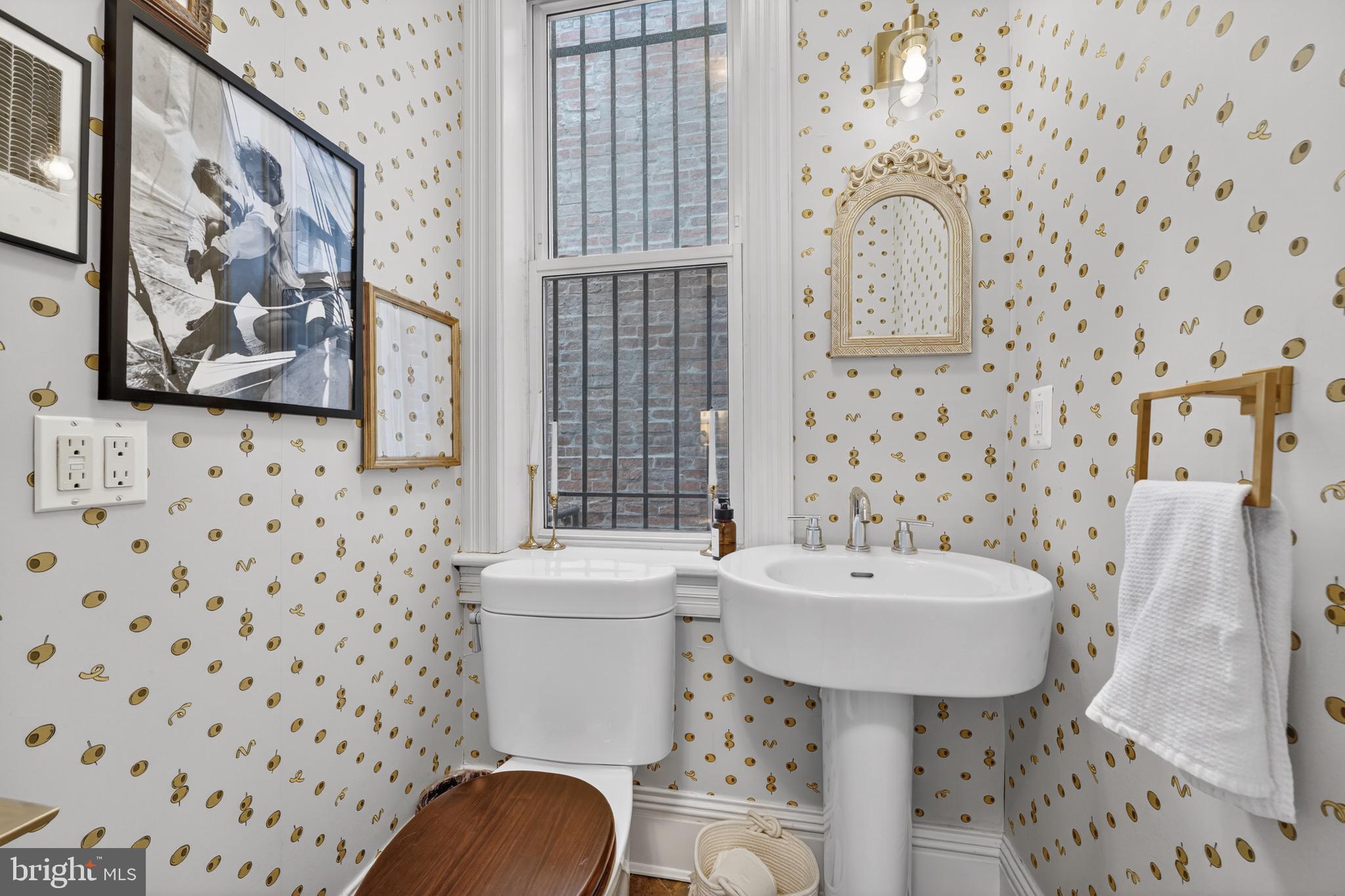 1731 Riggs Place Northwest, Unit 1 Washington, DC 20009 - Photo 4 of 20 a bathroom with a sink toilet and shower