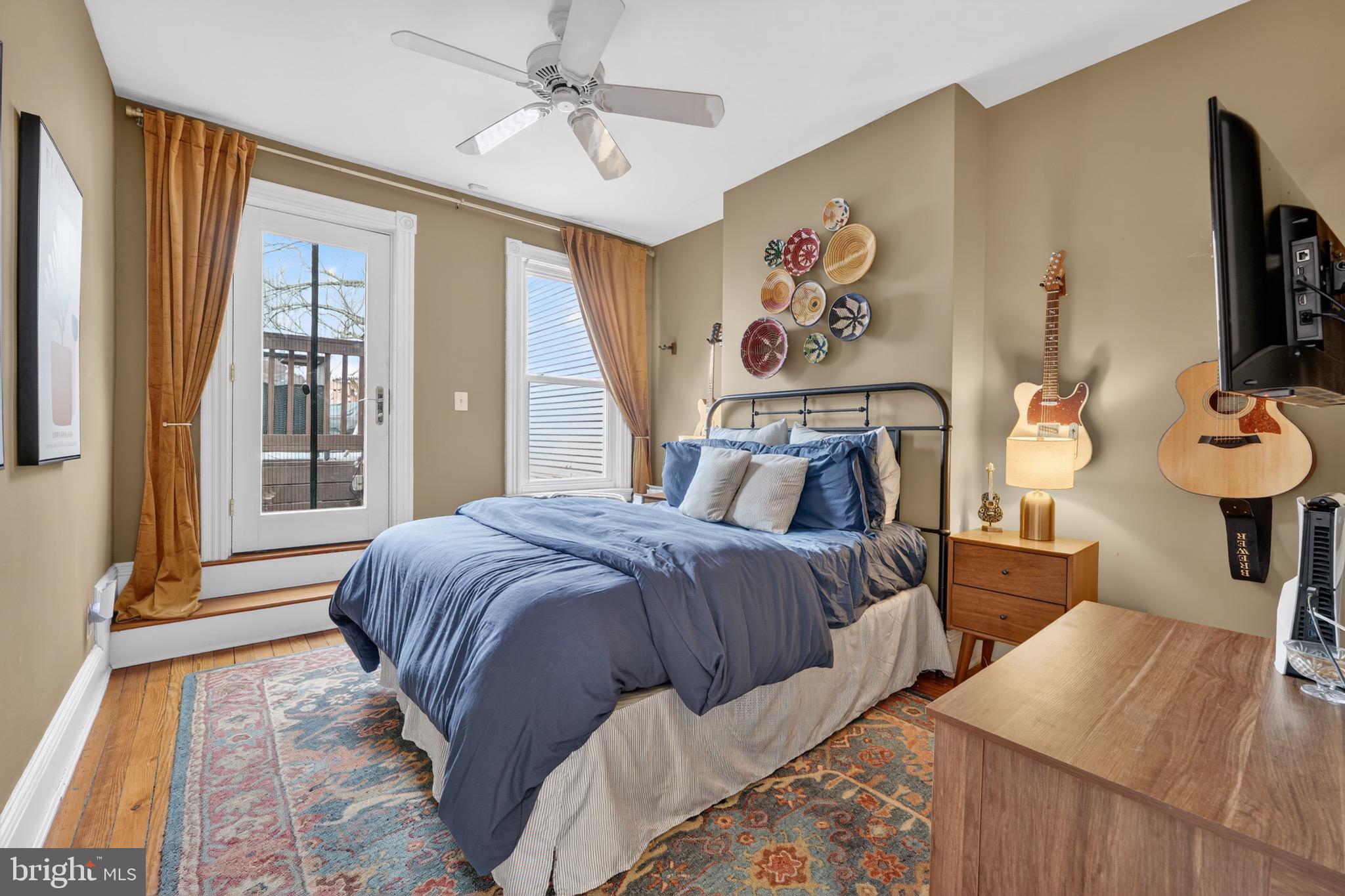 1731 Riggs Place Northwest, Unit 1 Washington, DC 20009 - Photo 7 of 20 a bed sitting in a bedroom next to a window