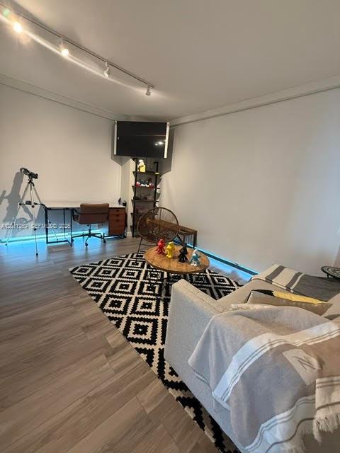 460 Northeast 28th Street, Unit 3408 Miami, FL 33137 - Photo 13 of 37 a bedroom with furniture and wooden floor