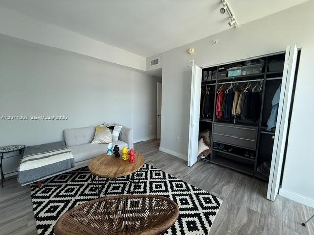 460 Northeast 28th Street, Unit 3408 Miami, FL 33137 - Photo 16 of 37 a living room with a rug and a wooden floor