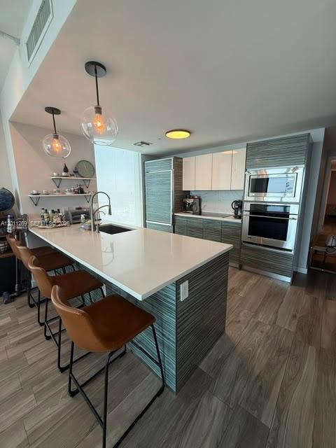 460 Northeast 28th Street, Unit 3408 Miami, FL 33137 - Photo 21 of 37 a kitchen with a table and chairs in it