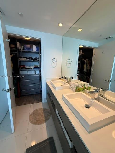 460 Northeast 28th Street, Unit 3408 Miami, FL 33137 - Photo 26 of 37 a bathroom with a sink a double vanity and a mirror