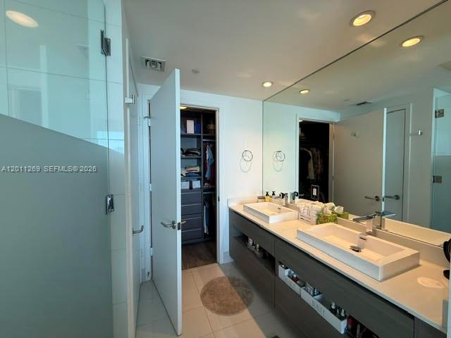 460 Northeast 28th Street, Unit 3408 Miami, FL 33137 - Photo 27 of 37 a bathroom with a sink double vanity and a mirror