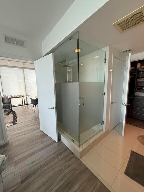 460 Northeast 28th Street, Unit 3408 Miami, FL 33137 - Photo 28 of 37 a view of a hallway view with wooden floor and staircase