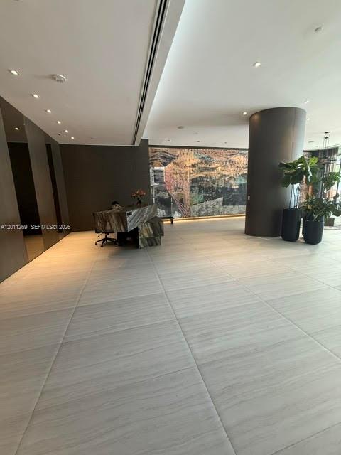 460 Northeast 28th Street, Unit 3408 Miami, FL 33137 - Photo 30 of 37 a lobby with furniture and a floor to ceiling window