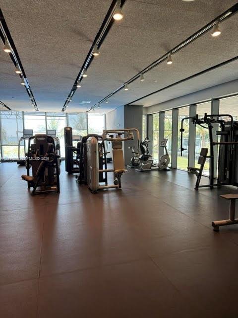 460 Northeast 28th Street, Unit 3408 Miami, FL 33137 - Photo 32 of 37 a view of a room with gym equipment