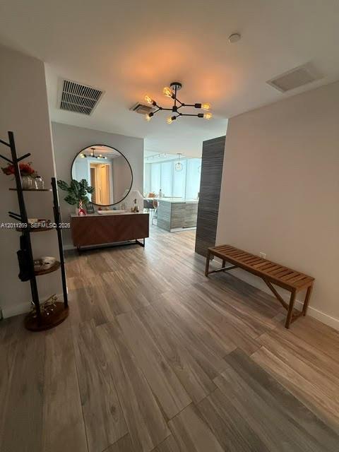 460 Northeast 28th Street, Unit 3408 Miami, FL 33137 - Photo 4 of 37 a living room with furniture and a wooden floor