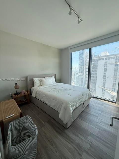 460 Northeast 28th Street, Unit 3408 Miami, FL 33137 - Photo 6 of 37 a bedroom with a bed couch and window