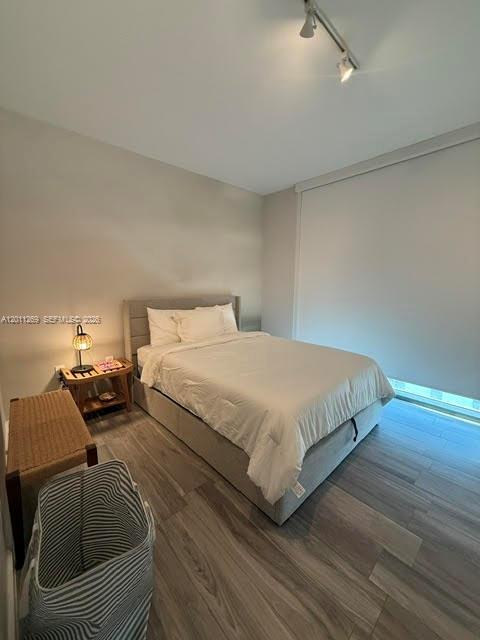 460 Northeast 28th Street, Unit 3408 Miami, FL 33137 - Photo 10 of 37 a bedroom with a bed and lamp