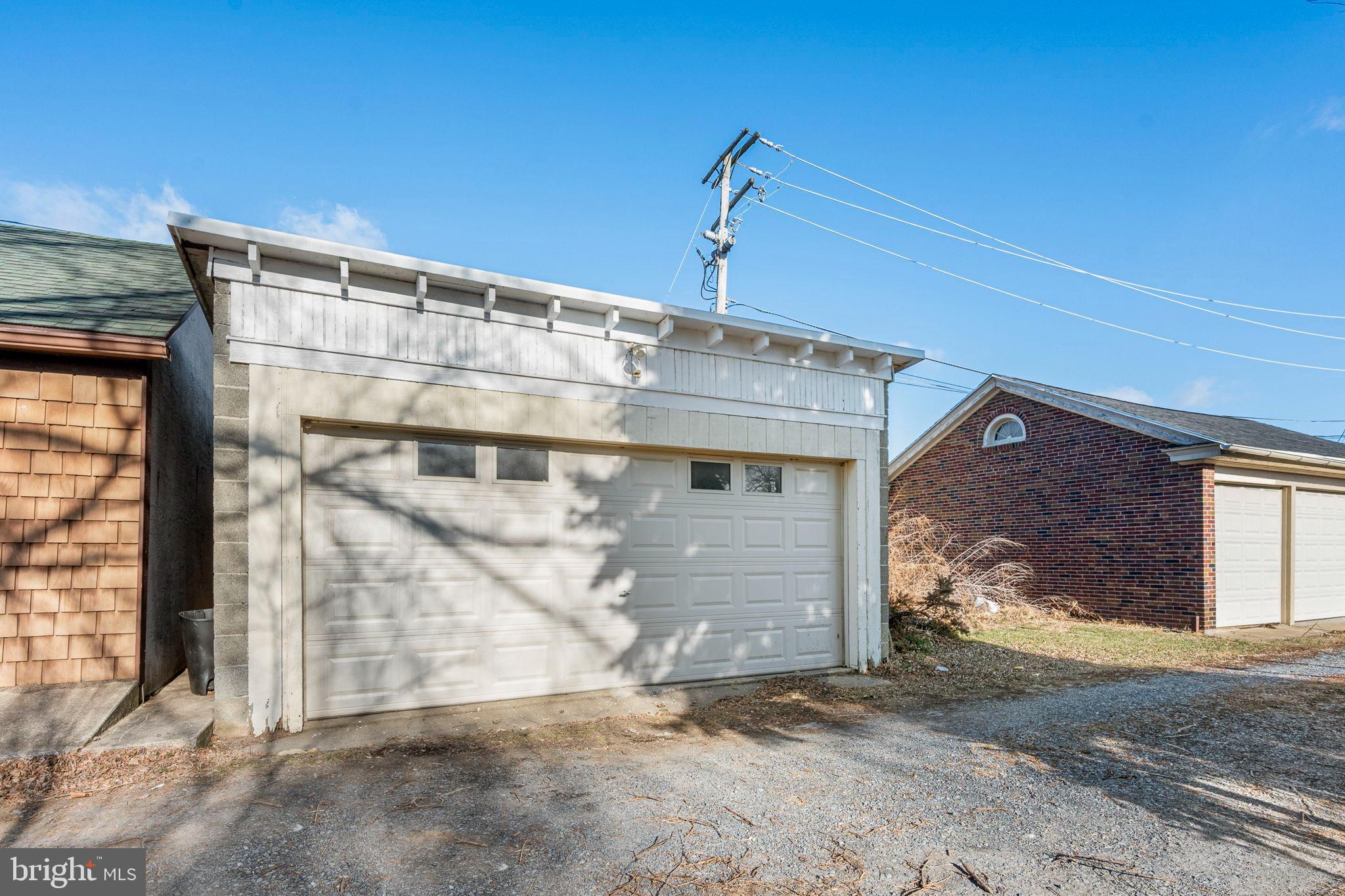 207 George Street Reading, PA 19605 - Photo 20 of 22 Charming garage with a sunny backdrop.