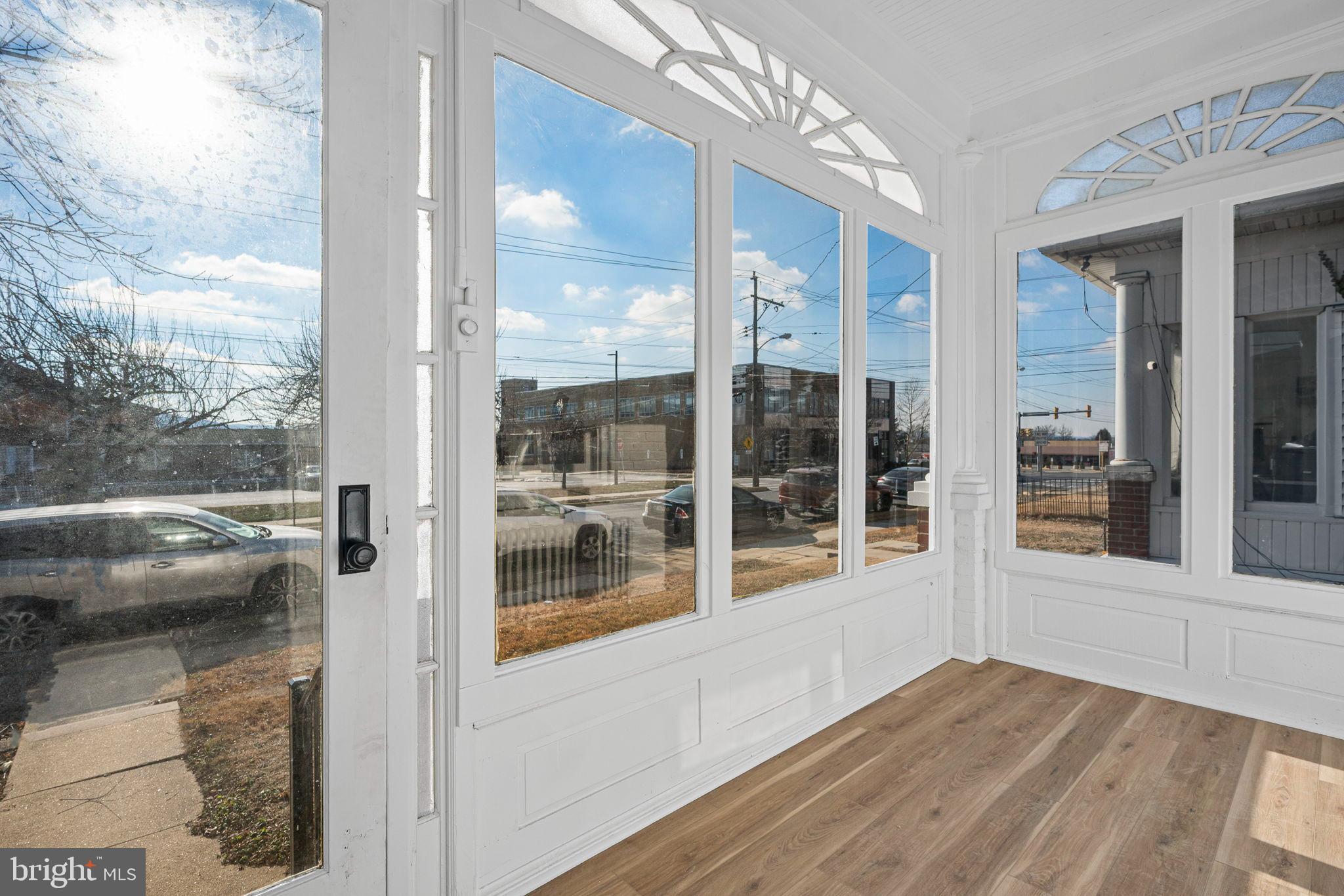 207 George Street Reading, PA 19605 - Photo 3 of 22 Bright sunlit entry with expansive windows.