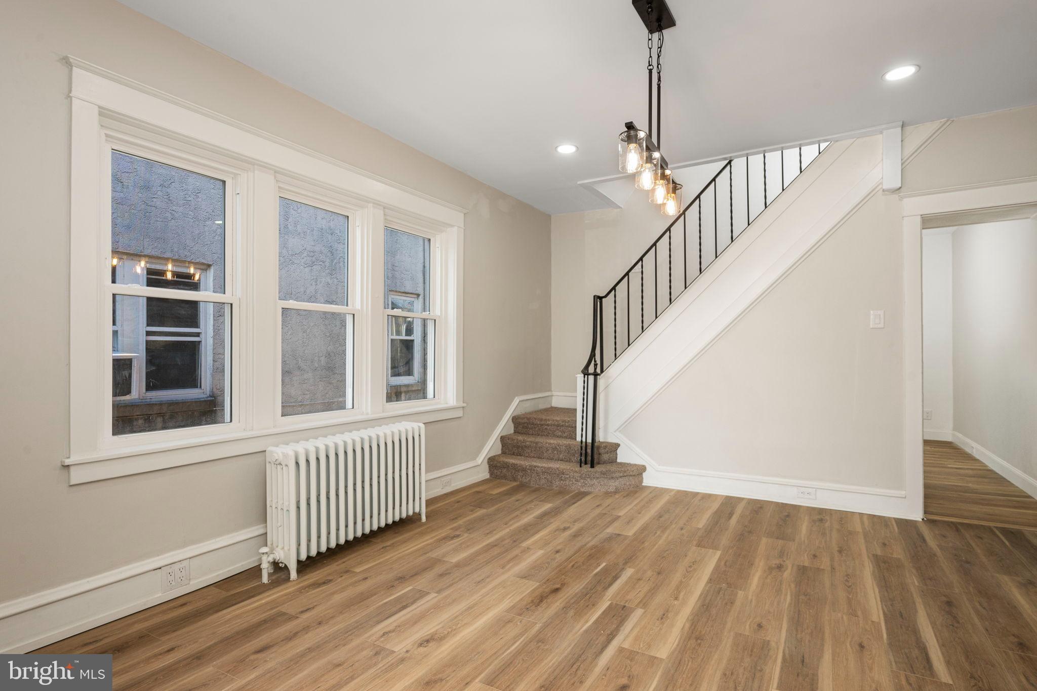 207 George Street Reading, PA 19605 - Photo 7 of 22 Bright and airy entryway with modern charm.