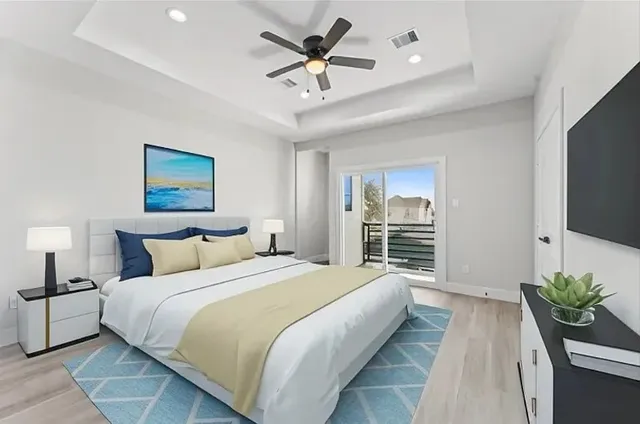 a bedroom with bed and a chandelier