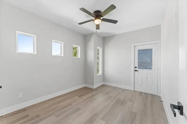 a view of an empty room with a window