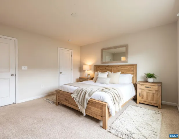 a bedroom with a bed and with furniture