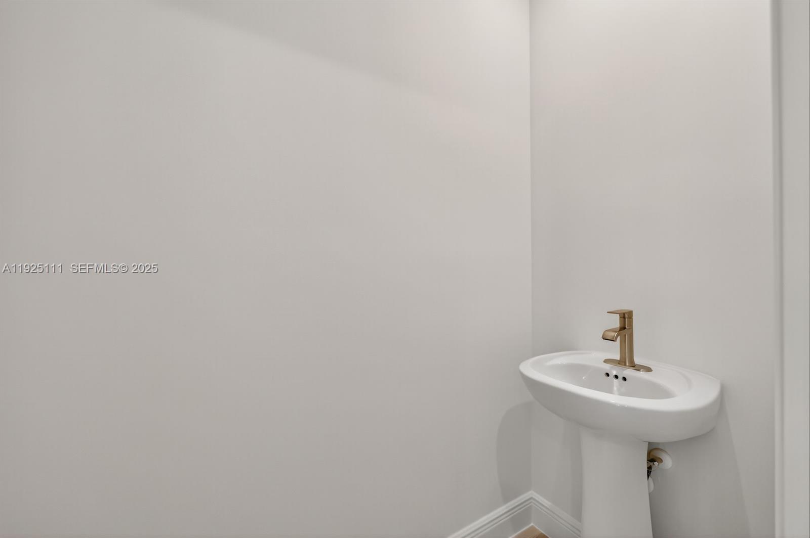 3585 Northwest Solange Court, Unit 3585 Jensen Beach, FL 34957 - Photo 15 of 33 a bathroom with a sink and mirror