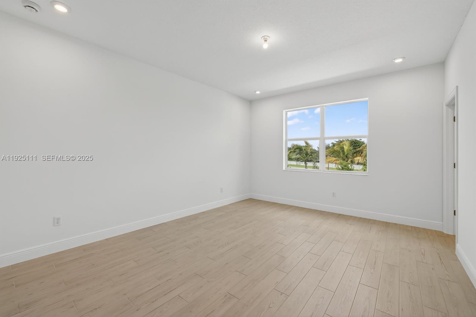 3585 Northwest Solange Court, Unit 3585 Jensen Beach, FL 34957 - Photo 16 of 33 an empty room with windows