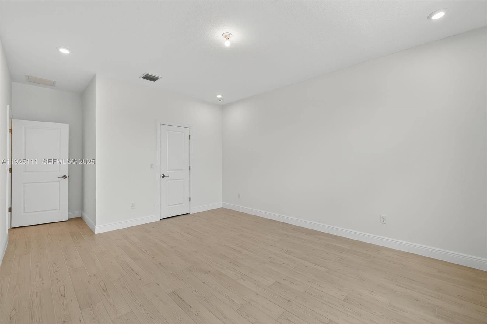 3585 Northwest Solange Court, Unit 3585 Jensen Beach, FL 34957 - Photo 17 of 33 an empty room with an entryway