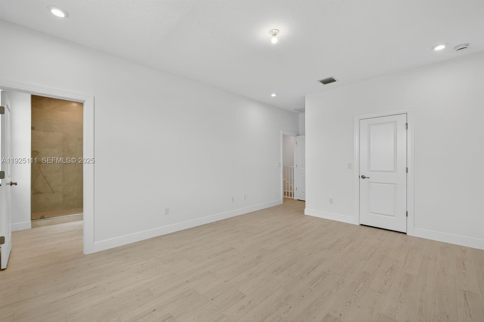 3585 Northwest Solange Court, Unit 3585 Jensen Beach, FL 34957 - Photo 18 of 33 an empty room with an entryway