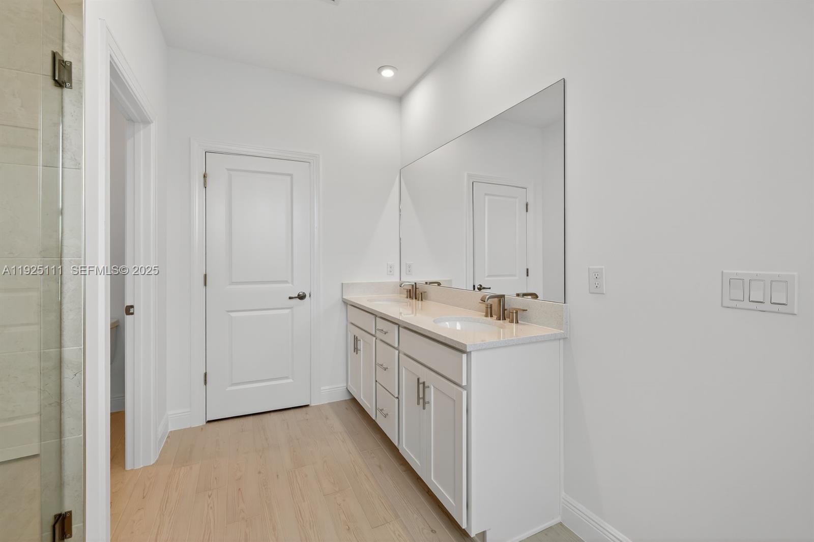 3585 Northwest Solange Court, Unit 3585 Jensen Beach, FL 34957 - Photo 21 of 33 a room with a sink and a mirror