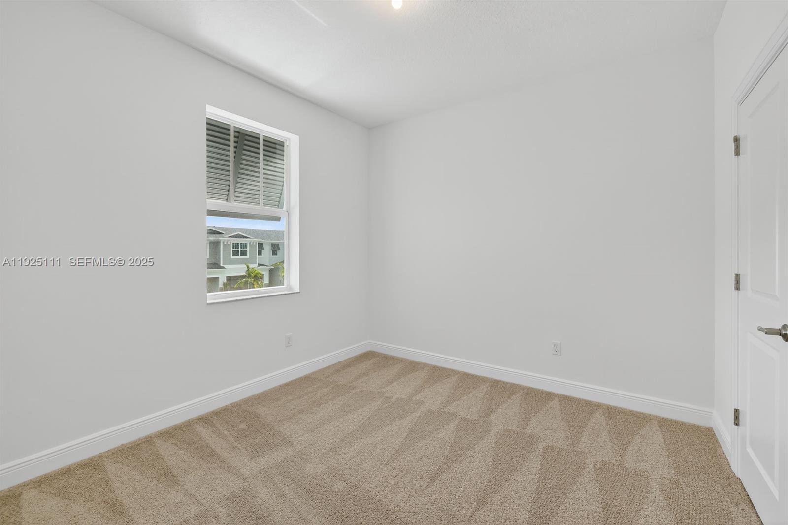 3585 Northwest Solange Court, Unit 3585 Jensen Beach, FL 34957 - Photo 22 of 33 an empty room with windows