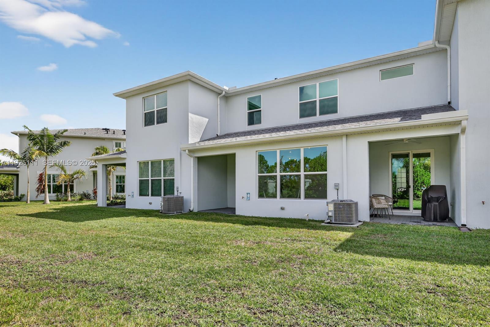 3585 Northwest Solange Court, Unit 3585 Jensen Beach, FL 34957 - Photo 32 of 33 a view of a yard in front of a building