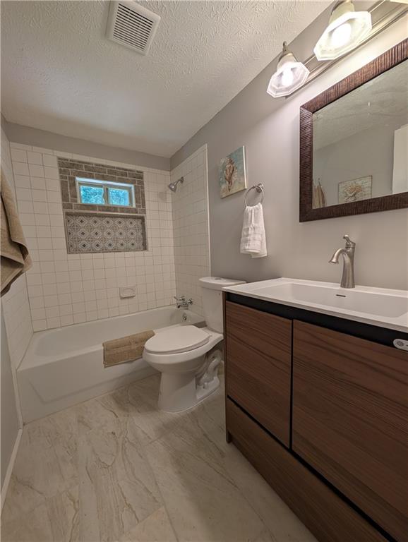 107 South Gates Road Pine Mountain, GA 31822 - Photo 14 of 18 a bathroom with a toilet a sink and mirror