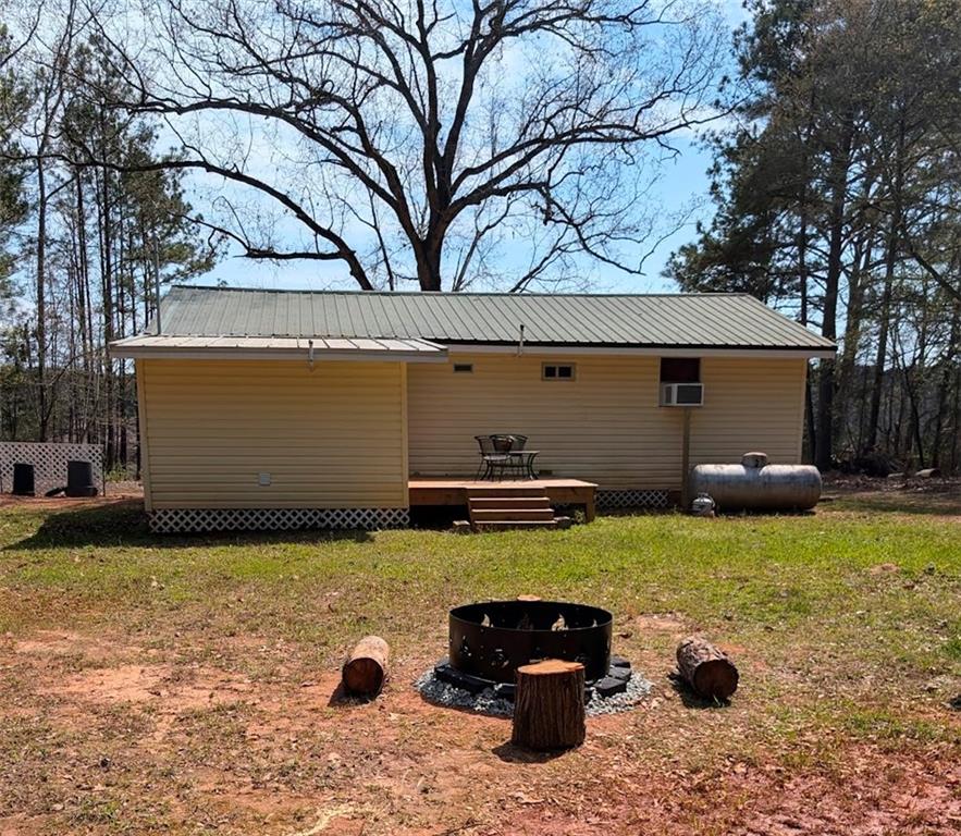 107 South Gates Road Pine Mountain, GA 31822 - Photo 17 of 18 a view of a house with backyard outdoor space and sitting area